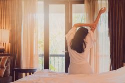 Asian Women Are Staying In A Hotel Room After Wake Up On Morning