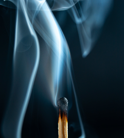 extinguished match with smoke